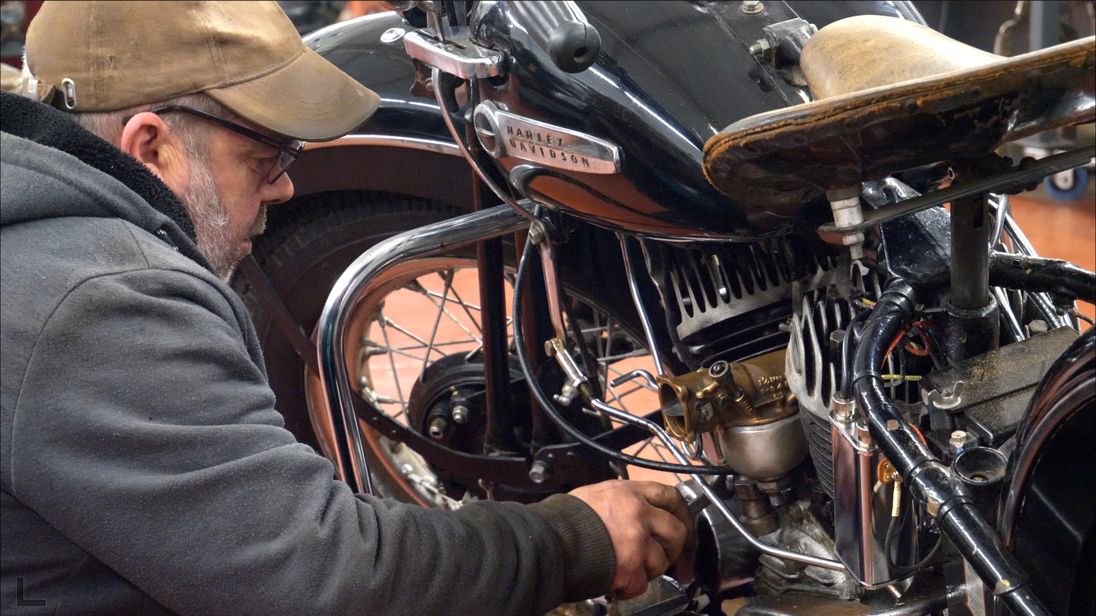 Ash working on a classic motorcycle engine